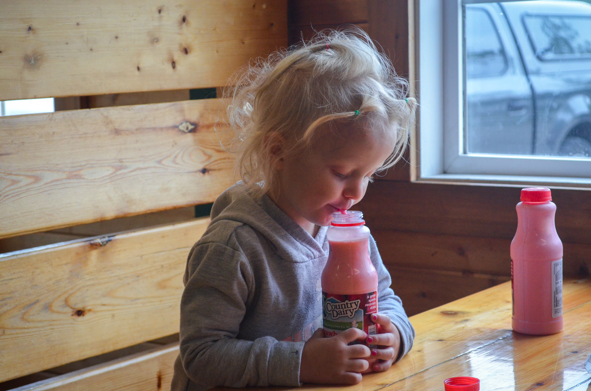Little girl enjoying Country Dairy strawberry milk